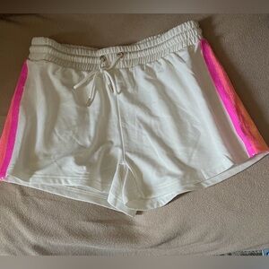 Mary Square shorts with vibrant pink and orange sequin stripes.